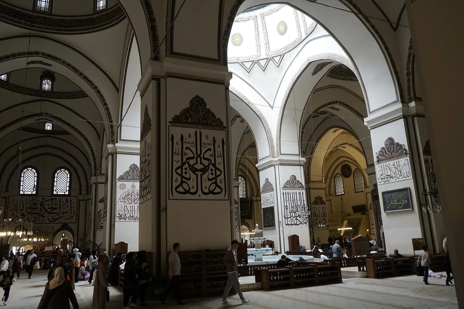 Interior of the Ulu Cami in Bursa with pillars, calligraphy and an open central dome